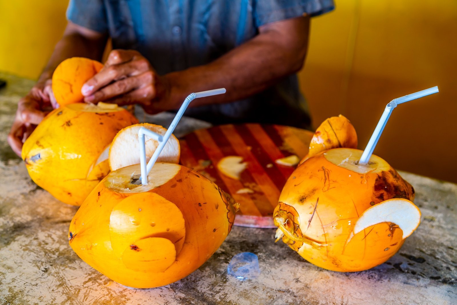 preparing-of-a-coconut-for-drinking-on-a-hikkaduwa-market-at-sri-lanka