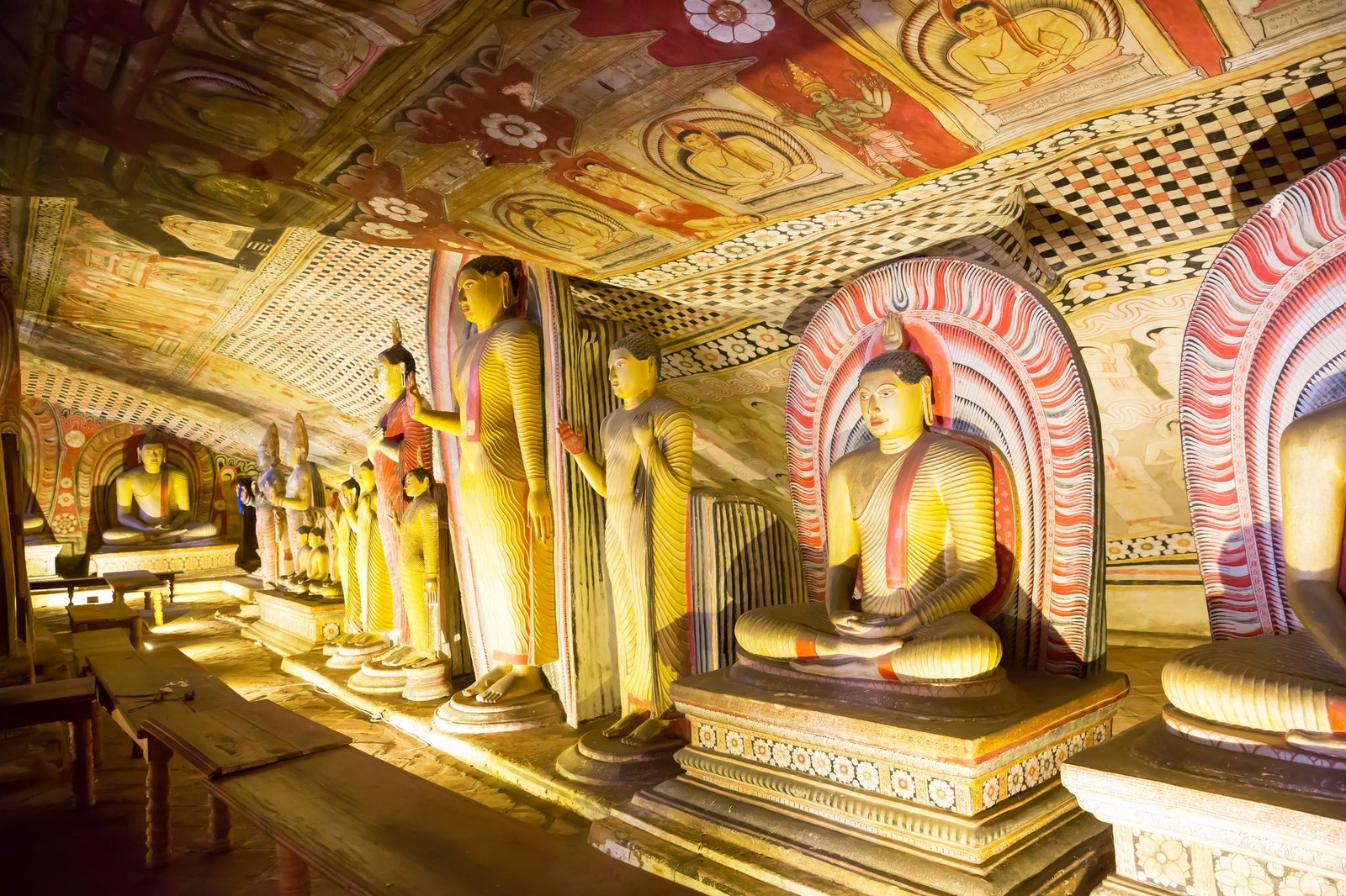 Ancient golden statues in buddha temple on Ceylon